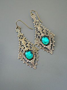 "Vintage Jewelry - Vintage Earrings - Art Nouveau Earrings - Emerald Green Earrings - Filigree Earrings - Brass Earrings - handmade jewelry These are such exquisite earrings! Gorgeous long vintage brass intricate lacy earrings embellished with an emerald green glass stone. If you would like these for your bridesmaids just let me know. Chloe says, \"Wear them and feel fabulous!\" They measure a stunning 2 1/2\" long\" from the top of the ear wire. Thanks for visiting Chloe's" Elegant Green Earrings With Intricate Design, Handmade Vintage Sterling Silver Chandelier Earrings, Elegant Green Plug Earrings As Gift, Elegant Green Plug Earrings For Gift, Vintage Turquoise Earrings For Party, Ornate Brass Pierced Earrings, Vintage Pierced Earrings As A Gift, Ornate Pierced Brass Earrings, Bohemian Nickel-free Party Earrings