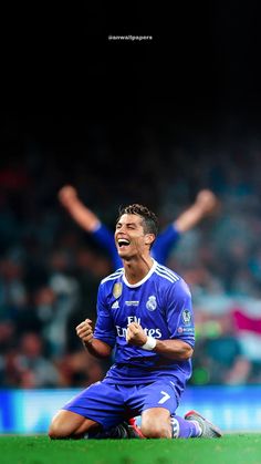 the soccer player is celebrating his goal on the field