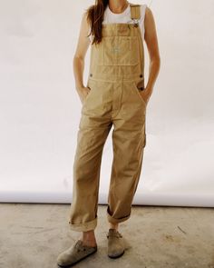 Our Unisex fit in a 100% Cotton Herringbone Twill, enzyme rinsed for a really nice feel. These are a looser and roomier fit which are based off of our favorite vintage pair of overalls! These include lots of little details including green accent stitching, a carpenter loop + pocket, and triple needle stitch seams. They are designed to fit oversized. You can size down for a more fitted look if preferred. 00 / XXS (jean size 24-25) | 0 / XS (jean size 26-27) | 1 / S (Jean size 28-29) | 2 / M (jean Carhartt Overalls Women Outfit, Fisherman Overalls, Tan Overalls Outfit, Carhartt Overalls Women, Mission Trip Outfits, Yellow Overalls, Nye 2024, Overalls Outfits, Oversize Outfit