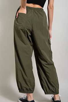 - Parachute cargo pants that features one back pocket as well as one side cargo pocket, elastic and pull drawstring waistband, elastic cuffs for the parachute effect, a metal belt loop for detail and added seams going throughout. - Model is 5'8" and is wearing a small. - Elastic waist.- Great fit. - 100% POLYESTER Parachute Cargo Pants, Parachute Cargo, Metal Belt, Cargo Pocket, Cargo Pant, Back Pocket, Drawstring Waistband, Cargo Pants, Elastic Waist