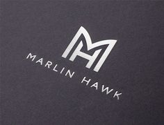 the marlin hawk logo is shown in white on black canvas fabric, which also has an embossing pattern