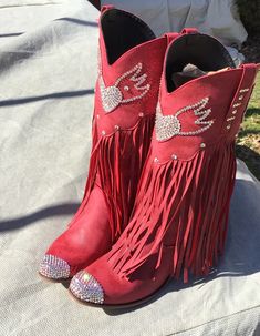 Ok, friends! Here we go1,000% authentic, genuine SWAROVSKI crystal rhinestone cowboy boots. These are not knock off stones, these are THE REAL DEAL! They are made with only the strongest adhesives and stones ranging in sizes from 3-6 mm for the brightest sparkle Soooooo fun! These boots are a gorgeous shade of deep crimson red, and are encrusted throughout with clear stones. These are man made material boots, yet still very nice quality. They have a really neat fringe flow curtain as well....I l Western Rhinestone Fringe Boots For Fall, Western Boots With Rhinestone Fringe For Fall, Western Rhinestone Boots With Round Toe, Western Boots With Rhinestones And Round Toe, Rhinestone Boots With Round Toe For Rodeo, Western Snip Toe Boots With Rhinestones, Western Boots With Rhinestones And Snip Toe, Western Boots With Rhinestone Fringe And Round Toe, Western Style Snip Toe Boots With Rhinestones