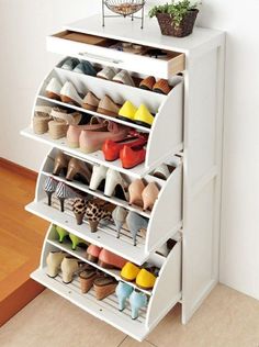 a white shoe rack filled with lots of shoes