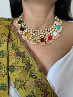 Be your own kind of beautiful. Simply a mark of royalty and elegance! You will definitely fall in love with the beautifully placed multicolored stones with Kundan Stone embellishments. One of our favorite picks for the wedding season ❤️ The pretty statement earrings add to the royalty of the stunning choker necklace. Length of earrings: 7 cms  Width of earrings: 3.3 cms Luxury Elegant Kundan Necklace With Cutdana, Luxury Blue Traditional Kundan Necklace, Elegant Multicolor Necklace For Festive Season, Elegant Multicolor Kundan Necklace, Elegant Multicolor Meenakari Necklace, Elegant Multicolor Necklace For Festivals, Festive Multicolor Multi-stone Bridal Necklace, Elegant Multicolor Necklaces For Festivals, Elegant Multi-stone Kundan Necklace For Wedding