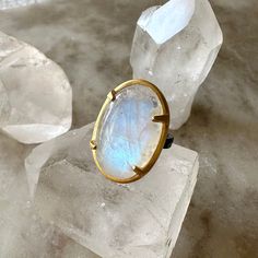 by Robindira Unsworth Handmade at our design studio in California One-of-a-kind Rainbow moonstone Oxidized sterling silver, 14k gold vermeil Style No. R476-OG Ethereal Oval Moonstone Ring, Handmade Gold Moonstone Ring In Sterling Silver, Handmade Yellow Gold Moonstone Ring In Sterling Silver, Hand Forged Round Moonstone Ring, Ethereal Oval Moonstone Jewelry, Unique Yellow Gold Moonstone Ring, Unique Oval Yellow Gold Moonstone Ring, Unique Yellow Gold Oval Moonstone Ring, Unique Oval Moonstone Ring In Yellow Gold