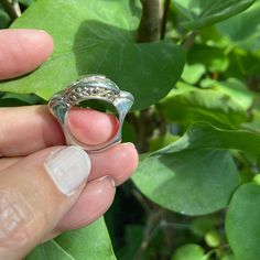 A lovely plain sterling silver ring. A highly polished rectangular plaque is mounted on beautiful scrolled wire work. The shank of the ring is sculptural and gives this ring the look and feel of another time and place. That design is 3 cm wide x 1.5 cm Only in size 6.75 and size 7 Engraved Silver Dome Ring In Fine Jewelry Style, Engraved Silver Dome Ring Fine Jewelry, Unique Silver Rectangular Rings, Unique Rectangular Silver Rings, Modernist Silver Dome Ring Open Style, Silver Dome Ring With Polished Finish, Unique Silver Dome Ring For Anniversary, Elegant Dome Ring Stamped 925 For Anniversary, Elegant Dome Ring For Anniversary, Stamped 925