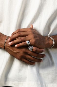 Made with high-quality metal, the Dean Ring features a sleek and modern design, seamlessly blending vintage-inspired and contemporary elements. This gold-vermeil or oxidized sterling silver ring is an expression of your individuality and taste. This piece is not just a ring; it's a symbol of confidence and style that stands the test of time. 17mm x 12mm setting 3mm black cubic zirconia Oxidized sterling silver or gold vermeil/cubic zirconia Imported Modern Silver Engraved Ring Tarnish Resistant, Modern White Gold Tarnish-resistant Signet Ring, Modern Tarnish Resistant Silver Initial Ring, Modernist Everyday Jewelry With Polished Finish, Everyday Modernist Jewelry With Polished Finish, Black Gold Ring, Contemporary Elements, Mens Gold Jewelry, Mens Gold Rings