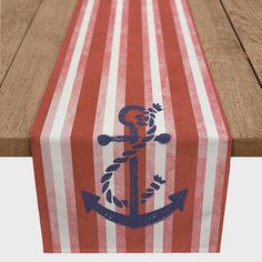 an anchor on a striped table runner