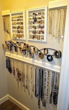 there are many necklaces hanging on the wall