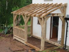 a small white house with a wooden porch