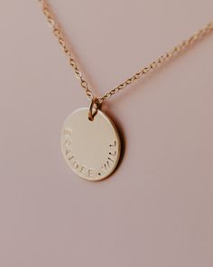 Name Disc Necklace The Name Disc Necklace is the perfect way to personalize your necklace with a special word or name that has meaning to you. With its smooth texture, your necklace will be stamped along the bottom edge of the disc. Disc measures at approximately a 1/2" in diameter. ***Max of 12 characters can be stamped on the disc. Please indicate your personalization in the box above. NOTE: Discs will be personalized exactly as indicated in the personalization box above.*** Made in 14k Gold F Meaningful Custom Name Necklaces For Everyday, Custom Name Necklace For Everyday Use, Minimalist Hand Stamped Necklace For Personalized Gift, Simple Everyday Hand Stamped Necklace, Simple Hand Stamped Everyday Necklace, Simple Hand Stamped Necklace For Everyday, Meaningful Everyday Jewelry With Round Pendant, Everyday Meaningful Jewelry With Round Pendant, Minimalist Hand Stamped Name Necklace