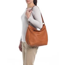 "THE SIZE SHOWN IN PICTURES IS THE LARGE HOBO BAG. This tan soft leather bag from the HELEN collection is our most popular product as it is also a stylish women laptop bag. A feminine and modern large lightweight leather bag designed with plenty of storage space and organiser pockets is a must have purse for every women. Ideal for any occasion and any style you can wear this tan hobo purse short on the shoulder or using the long strap you can go with a casual style and hands - free. That makes a Versatile Hobo Bag With Leather Lining For Daily Use, Casual Everyday Hobo Bucket Bag, Casual Everyday Hobo Bag, Versatile Hobo Bag, Casual Hobo Bag For Everyday Use, Versatile Brown Hobo Bag With Leather Lining, Versatile Leather Lined Hobo Crossbody Bag, Everyday Leather Lined Hobo Shoulder Bag, Versatile Crossbody Hobo Bag With Leather Lining