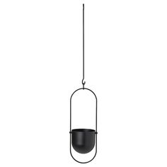 a black pot hanging from a wire on a white background