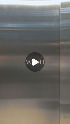 an image of a stainless steel refrigerator with the word wh on it's screen