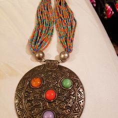 Never Worn. Purchased From A Market In India. 17 Inches From Top To Bottom. Pendant Is 4.25 Inches In Diameter. This Is A Magnificent Statement Piece. Colorful Seed Beads. Festival Multicolor Metal Beaded Necklaces, Bohemian Round Beads For Festivals, Festival Multicolor Beaded Necklaces, Festival Multicolor Metal Beads Necklace, Bohemian Beaded Necklace For Festival, Bohemian Multicolor Round Beads, Bohemian Colorful Round Beads, Multicolor Metal Beads Necklace With Silver Beads, Multicolor Metal Beaded Necklace With Silver Accents