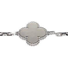 This Van Cleef & Arpels Vintage Alhambra 5 Motif Bracelet is in white mother of pearl and 18K white gold. There are five clover motifs of mother of pearl set in 18K white gold with a hallmark lobster clasp closure.Origin: FranceCondition: New and never wornAccompanied by: VCA gift box, VCA green jewelry box, authenticity card, carebookMeasurements: .5" x .5" motif pendant; 7" bracelet length Elegant Sterling Silver Tarnish Resistant Bracelet, Luxury Engraved White Gold Chain Bracelet, Luxury White Sterling Silver Jubilee Bracelet, Luxury Jeweled White Sterling Silver Bracelet, Luxury White Sterling Silver Chain Bracelet, Luxury White Sterling Silver Bracelet For Gift, Luxury White Sterling Silver Bracelet As Gift, Luxury Engraved Diamond Bracelet, Luxury White Gold Chain Bracelet Tarnish Resistant