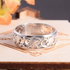 "Unique 925 sterling silver womens filigree wedding band, Simple & elegant art nouveau wedding band for her, Dainty art deco wedding band This is a stunning, feminine ring that works well for all occasions, styles, and ages. You will love it! Ring information Metal type: Silver Metal stamp: 925 Sterling SIlver Customization / Replacements It's easy to create jewelry that's perfect for you. Change the materials to suit your style and budget: Ruby, Emerald, Blue Sapphire, Amethyst, Topaz, Garn Elegant Silver Carved Engraved Ring, Sterling Silver Art Deco Jewelry For Wedding, Elegant Carved Jewelry For Promise Ring, Art Deco Sterling Silver Jewelry For Wedding, Elegant Silver Bands For Marriage, Classic Silver Band Jewelry, Filigree Ring For Wedding, Filigree Marriage Ring Jewelry, Elegant Carved White Gold Rings