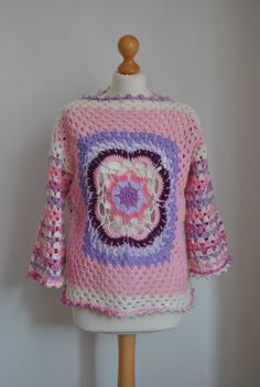 This is a timeless hand crochet Boho style sweater, jumper. It's ideal for transitional months or for cold summer evenings. Featuring a mandala in the centre of a jumper can be worn bought sides.  Pair with your favourite jeans for a cool Boho, casual look. Size: M Material: Acrylic Measurements: Bust: 104cm/40in Waist: 104cm/40in Sleeves: 39cm/15in Length: 56cm/22in Bohemian Hand Knitted Long Sleeve Tops, Bohemian Crochet Lace Top With Crew Neck, Handmade Bohemian Cotton Sweater, Bohemian Crochet Lace Crew Neck Sweater, Handmade Cotton Bohemian Sweater, Spring Festival Crochet Sweater, Bohemian Crochet Lace Top For Winter, Winter Bohemian Crochet Top With Crew Neck, Winter Bohemian Cotton Crochet Top