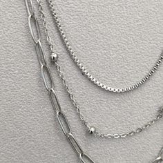 Triple-strand necklace made of titanium steel, weighing 13 grams. Silver Layered Chain Necklace For Everyday, Minimalist Stainless Steel Necklace With Double Chain, Silver Double Strand Metal Necklace, Minimalist Stainless Steel Double Chain Necklace, Minimalist Silver Necklace With Double Chain, Minimalist Silver Double Chain Necklace, Stainless Steel Necklace With Adjustable Chain, Silver Double Strand Necklace With Adjustable Chain, Silver Stainless Steel Necklace With Box Chain