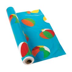 a roll of blue wrapping paper with colorful circles on it