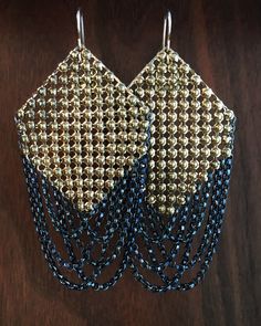 Gold mini-stud mesh is culled from a vintage purse (circa 1930-50s) and swagged with dark oxidized sterling silver chain. Machine Age Mesh Earrings are 1.5" wide and hang 3" long including the 14k gold filled ear wires. Each earring is signed with our logo link.