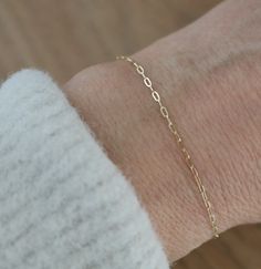 Elevate her wrist with our exquisite paperclip chain bracelet, a delicate yet striking piece crafted in 14K solid gold, perfect for women seeking timeless elegance. This dainty gold bracelet is an ideal birthday gift or a thoughtful token for the bride on her wedding day, ensuring a cherished adornment she'll treasure forever. DETAILS: 💍 Material: 14 Karat Solid Gold 💍 Sizes: available in sizes 6, 6.5, 7, 7.5 & 8 💍 Style: 1.25 mm paperclip chain HOW TO ORDER: 💍 Select Size (see photo on how 14k Gold Filled Adjustable Paperclip Bracelet, Dainty Gold Paperclip Bracelet, Dainty Tarnish-resistant Paperclip Bracelet For Formal Occasions, Elegant Gold Bracelet With Paperclip Chain For Gift, Elegant Paperclip Bracelet With Delicate Chain As Gift, Elegant Paperclip Bracelet With Delicate Chain For Gift, Dainty Formal Paperclip Bracelet With Cable Chain, Dainty 14k Gold-filled Paperclip Bracelet With Delicate Chain, Dainty Paperclip Bracelet With Delicate Chain In 14k Gold