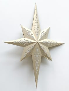 an origami christmas star on a white background