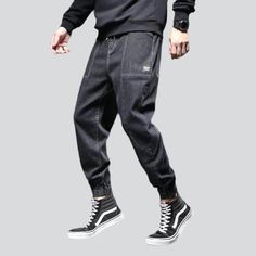 Take your fashion game to the next level with our 2023 Autumn Collection's street dark men's denim joggers! These monochrome. mid-waist joggers are perfect for making a statement. yet still keeping it comfortable and stylish. With their drawstring closure and stretchy fabric. they promise to keep you looking sharp even during the most intense streetwear looks.Why You'll Fall In Love Street Style: Make an impact with these joggers. designed to keep you looking your best no matter the season or oc Urban Tapered Leg Joggers For Streetwear, Casual Straight Leg Joggers For Streetwear, Urban Straight Leg Joggers For Streetwear, Sporty Black Denim Bottoms, Black Relaxed Fit Joggers For Elevated Casual, Sporty Black Denim Jeans, Urban Joggers For Spring Streetwear, Urban Spring Joggers For Streetwear, Sporty Denim Jeans For Streetwear