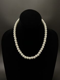 A classic elegant pearl necklace with especially man-made high-quality shell pearl from Kobe Japan. This shell pearl authentically conveys the natural look of the Tahitian Pearl. This beaded necklace is made with a strong Japanese wire and finishing method. It's perfect for gifts to yourself, your loved ones, mother, and friends. **Pearl Type: Shell Pearl, especially man-made high-quality shell pearl from Kobe Japan. **Pearl Size: 7 mm **Pearl Color: Ivory White, High Luster **Pearl Shape: Round Korea Jewelry, Kobe Japan, White Pearl Necklace, Pearl Types, Tahitian Pearls, Classic Elegant, Pearl Chain, Pearl Color, Pearl Size