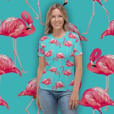 You'll look flamazing in this tee! Women's crew neck tee with all-over tropical pink flamingo pattern print sublimation - Sizes XS - 2XL. This product is made to order and will take at least 4-5 days to produce before it is shipped This exclusive design is only available at Hunky Donkey! SHIRT INFO: Get to know your new favorite tee--it's super smooth, super comfortable, and made from a cotton touch polyester jersey that won't fade after washing.  * 95% polyester, 5% elastane (fabric composition may vary by 1%) * Premium knit mid-weight jersey * Four-way stretch fabric that stretches and recovers on the cross and lengthwise grains * Regular fit CARE: Do not dryclean; Do not iron; Tumble dry: low heat; Do not bleach; Machine wash: cold (max 30C or 90F), gentle cycle. PACKAGING: Peel and sea Pink Cotton Top With Palm Tree Print, Pink All-over Print Crew Neck Tops, Pink All Over Print T-shirt For Spring, Pink Crew Neck Top With All Over Print, Pink Casual Top With All Over Print, Casual Pink Top With All Over Print, Pink Crew Neck Tropical T-shirt, Pink Palm Tree Print Short Sleeve Top, Summer Cotton Tops With Flamingo Print