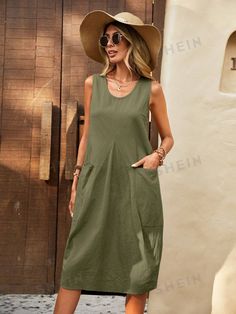 Effortlessly elevate your wardrobe with our Double the Chic: Solid Dual Pocket Curved Hem Tank Dress. This versatile dress features not one, but two pockets, perfect for keeping your essentials close by. The curved hem adds a unique touch to this solid colored dress, making it a must-have for any fashion-forward individual. Color : Army Green Style : Casual Details : Pocket Type : Tank Pattern Type : Plain Sleeve Length : Sleeveless Neckline : Scoop Neck Waist Line : Natural Hem Shaped : Straigh Summer A-line Midi Dress With Pockets, Longline Midi Dress For Summer, Casual Cotton Midi Dress In Solid Color, Casual Cotton Midi Dress Solid Color, Casual Solid Color Cotton Midi Dress, Cotton Shift Midi Dress In Solid Color, Sleeveless Dresses With Pockets In Solid Color, Beach Cotton Midi Dress With Pockets, Chic Solid Dresses With Pockets