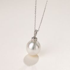 Material: 18K white gold, Teardrop South Sea Pearl, and diamonds South Sea Pearl saltwater cultured pearl Size of pearl: 12.0-13.0 mm The price of this product is only the pendant price, and a 45cm adjustable 925 silver chain is given as a gift. Weight of Diamonds: 9 diamonds approx. 0.086 carats Handpicked of every pearl, only the top 1% of pearls are selected Handcrafted Lifetime warranty Elegant Pendant, Sea Pearl, South Seas, South Sea Pearls, Sea Pearls, Akoya Pearls, Pearl Size, Gold Pearl, Gold Diamond