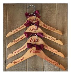 personalized wooden hangers with names and bows on wood planks, set of 6