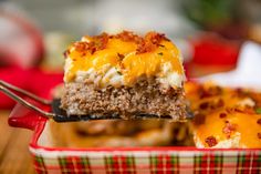 a close up of a piece of food on a plate with a fork in it