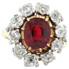 A fine antique red spinel and diamond ring in 18k yellow gold, early Victorian, ca. 1860s. The centre gemstone is an antique cushion cut spinel - not heated - accompanied by a gemological report. The spinel weighs 2.41 carats and has a vivid red colour and exceptional crystal. It is surrounded by old cut diamonds. The ring head is further accentuated by two smaller old cut diamonds on either side. The total diamond weight is approximately 2.6 carats. The ring has rubbed marks. Ring size 49 (US r Antique Cushion Cut, Spinel Jewelry, Antique Cushion, Contemporary Engagement Rings, Red Spinel, Pink Spinel, Spinel Gemstone, 18k Gold Earrings, Gold And Silver Rings