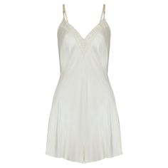 This teddy slip was made in the 1940s and displays many signature details of the era’s lingerie. It has the coveted war time CC41 label and is tailored from cream satin with coordinating spaghetti straps. It has a nipped-in, inverted empire waist and highly flattering bias cut. A chance to put a twist on the slip-dress trend, the modesty-protecting shorts make this a piece you’ll want to wear outside of the bedroom. Edged in cream lace trim accented with delicate pink and blue flower and bow emb Vintage Silk Slip Dress, Cami Mendes, Boardwalk Empire, Color Crema, Pink And Blue Flowers, Dreamy Dress, Empire Style, Cream Lace, Trending Dresses