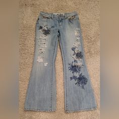 Nwot Size 9 Denim Ripped Jeans Color Blue Full Length Questions? Leave A Comment Below! Blue Distressed Flare Jeans For Spring, Vintage Blue Flare Jeans For Spring, Fitted Floral Print Casual Jeans, Fitted Denim Blue Jeans With Floral Print, Blue Denim Jeans With Floral Print, Y2k Distressed Denim Jeans, Fitted Floral Print Jeans In Denim Blue, Spring Floral Embroidered Cotton Flare Jeans, Fitted Floral Print Denim Blue Jeans