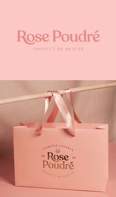 a pink bag with the words rose poudre in french and english on it