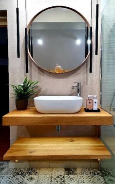 a bathroom with a sink, mirror and wooden steps leading to the shower stall area