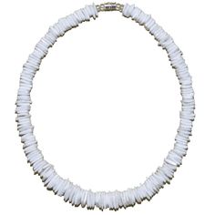 a white necklace on a white background