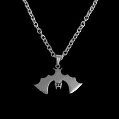 This Nocturnal Bat Necklace is made entirely from high-quality stainless steel - that's everything from the chain to the pendant (which measures approximately 17 mm x 28 mm). If the length you want isn't listed, then don't worry! Everything is made to order, so all you need to do is send me a message (before or within 24 hours of purchasing) confirming in inches the length that you would like. Halloween Stainless Steel Chain Necklace, Halloween Engraved Metal Necklace, Halloween Stainless Steel Pendant Jewelry, Vampire Jewelry, Bat Necklace, Gothic Vampire, Stainless Steel Jewelry, Chain Lengths, Chain Length