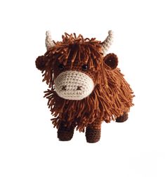 a brown and white stuffed animal with horns