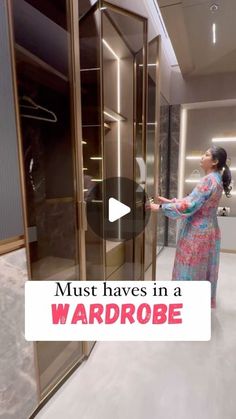 a woman standing in front of a glass door with the words must haves in a wardrobe