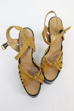 "Covetable 1970's mega platforms! Done in a faux snake embossed material. Strappy knotted uppers and HUGE black platforms and heels. Made in Italy. Brand: Made in Italy for QualiCraft Size on tag: 8B Fits like: 8 US / 5.5UK / 38.5 EU Color: tan Material: manmade materials looks like embossed snake Condition: Very Good Vintage: a little wear to the faux snake on the straps, some very shallow dents to heels. ✂-----Measurements Length Toe to Heel Inside: 9-7/8\" Width Widest Part of Sole Inside: 3\ Black Platforms, Snake Wood, Napa Ca, Caged Sandals, Full Circle Skirts, Retro Shoes, Black Platform, Strappy Sandals, Platform Sandals