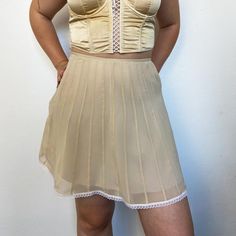 This delicate 100% silk skirt is made of silk muslin, a hand-dyed silk satin lining and a white lace braid. It sports a soft beige obtained from onion decoction, hand-dyed in my workshop in Nantes. Each piece is unique and natural, perfect for an eco-responsible and elegant wardrobe. Material: 100% silk for optimal comfort and softness. Details: White lace trim and English seams adding a feminine and elegant touch. Natural Dye: Hand dyed with yellow onion peels, each piece is unique! Size: This Beige Silk Skirt, Skirt With Lace Trim, Elegant Wardrobe, Skirt With Lace, Lace Braid, Garment Details, Beige Silk, Soft Beige, Dyed Silk