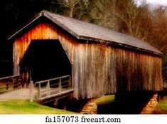 an old wooden covered bridge in the woods