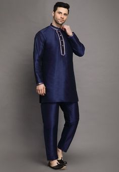 Art Silk Kurta in Navy BlueThis Readymade attire is Enhanced with Buttons. Crafted in Chinese Collar Neck and Full SleeveAvailable with an Art Silk Pajama in Navy BlueDo note: Footwear shown in the image is for presentation purposes only. Half to one inch may vary in measurement. (Slight variation in actual color vs. image is possible) We sell all kinds of menswear. Mens Kurta | Mens Kurta Pajama | Mens Sherwani | Mens Sherwani Sets | Traditional Menswear | Partywear Menswear | Indian Mens Dress Blue Bollywood Straight Kurta Set, Blue Straight Kurta Sets For Eid, Blue Art Silk Kurta With Long Sleeves, Blue Straight Kurta Set For Diwali, Blue Long Sleeve Kurta For Diwali, Blue Unstitched Set With Traditional Drape, Unstitched Blue Sets In Traditional Drape, Blue Long Sleeve Art Silk Kurta, Blue Art Silk Sets With Long Sleeves