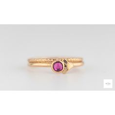 This beautiful set of elegant, handmade stacking rings feature a shimmering fuchsia (dark pink, magenta) colored cubic zirconia stone set in a gold filled bezel atop two gold-filled textured ring bands. The deep, sparkling color of the dark pink fuchsia pink cubic zirconia pairs perfectly with the bright gold lending a royal color combination and timeless beauty to the rings. US size 6, EU size 51.5: inside circumference is 2.04 inches, 51.9mm Elegant Gold Stackable Amethyst Ring, Pink Ruby Stackable Jewelry, Gold Amethyst Stackable Ring Fine Jewelry, Gold Amethyst Stackable Ring In Fine Jewelry Style, Gold Stackable Amethyst Ring, Gold Stackable Amethyst Ring In Fine Jewelry Style, Stackable Ruby Ring In 14k Rose Gold, Elegant Pink Sapphire Stackable Ring, Pink Ring With Bezel Setting