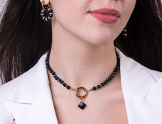 Elevate your style with our Onyx Necklace with Clover Charm, a stunning piece that's more than just a fashion statement--it's a touch of tranquility.  Why You'll Love It: 🍋 Chic and Protective: Onyx isn't just beautiful; it's believed to rebalance and harmonize the body, mind, and spirit. It's a little piece of magic to wear around your neck. 🍋 Customizable Look: Wear it with the lucky clover charm, swap it out for a different charm, or go charm-free for a sleek vibe. The choice is yours! 🍋 H Elegant Choker With Round Natural Stones, Elegant Choker With Natural Stones And Round Beads, Elegant Crystal Gemstone Beads Choker, Elegant Crystal Gemstone Bead Choker Necklace, Black Faceted Beads Choker As Gift, Black Choker With Faceted Beads As Gift, Black Obsidian Necklace, Obsidian Necklace, Clover Charm