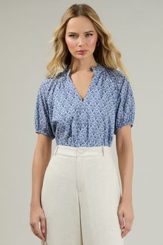 The Lena Floral Split Neck Top is an effortless way to show everyone you know style! Puff shorts sleeves enhance this cute top with a split neckline and ruffles around the neck. You can tuck it in or as is with white pants and some heels or loafers to go along. - V-neck- Ruffle trim- Short sleeves- Lined- Color: Blue whiteSize + Fit - Model is 5'8" and wearing size XS- Measurements taken from size S - Chest: 21"- Length: 24 1/2" Fabric Self: 100% Cotton, Lining: 97% Polyester 3% Spandex Style Nu Elle Magazine, Neck Ruffle, Cute Top, White Pants, Staple Pieces, Ruffle Trim, Cute Tops, Quality Clothing, Everyday Essentials Products